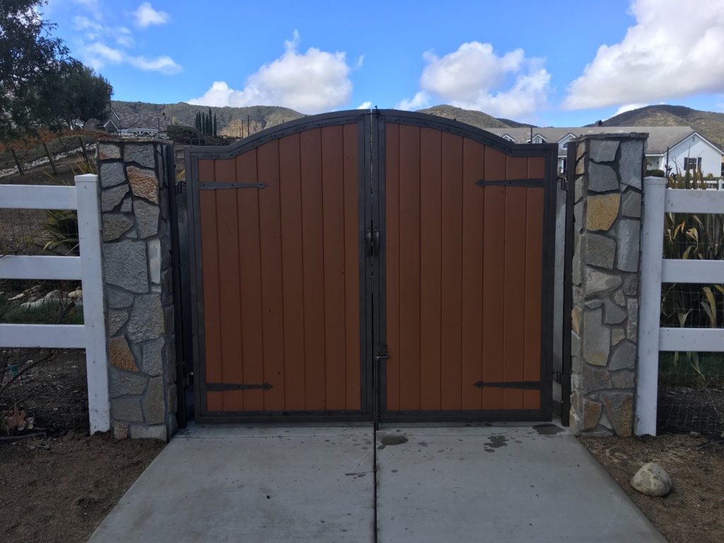 Wood-finish gate with masonry columns